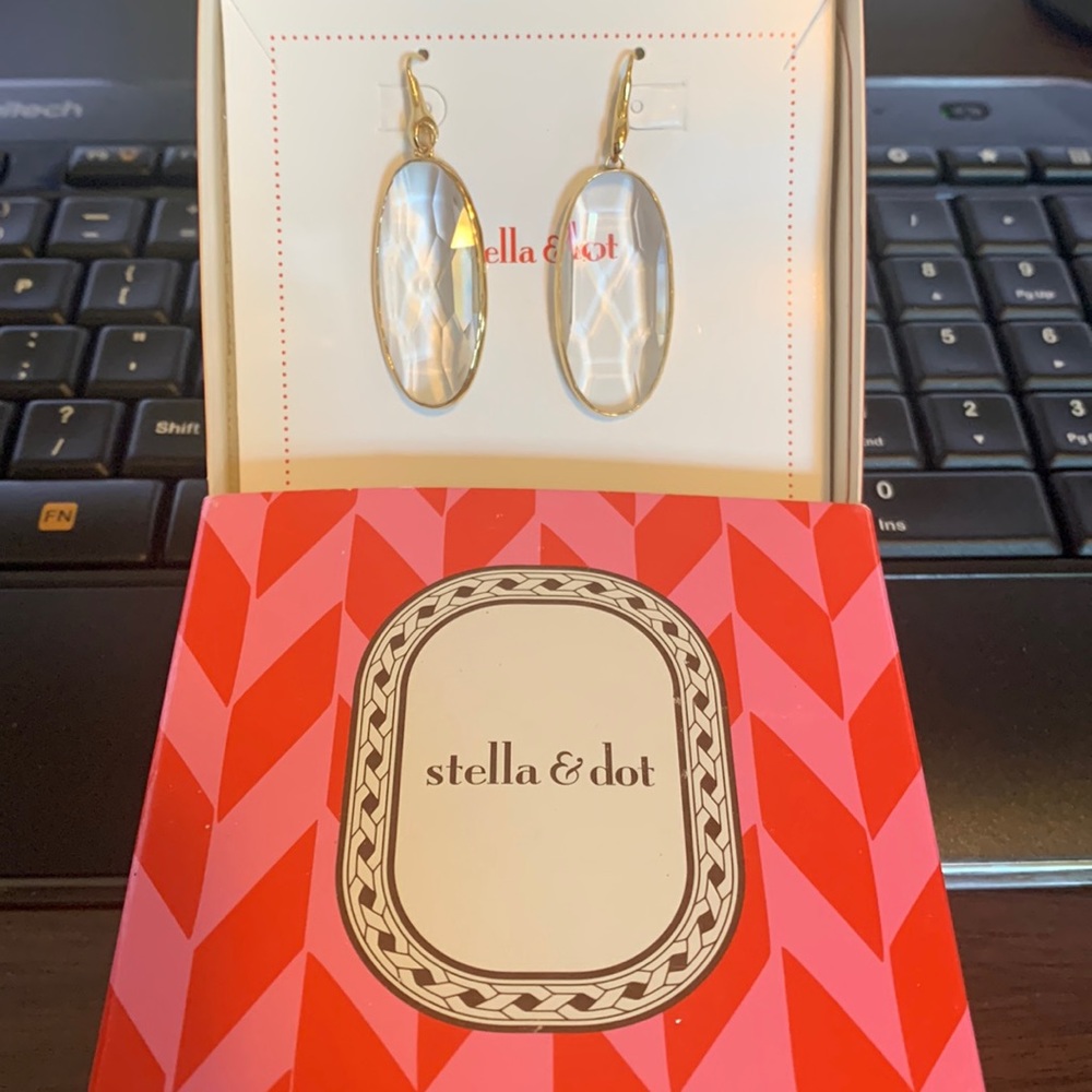 Stella & Dot pierced earrings. Never been worn. Clear with gold trim.